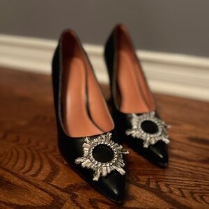 Black high heals with brooch embellishment